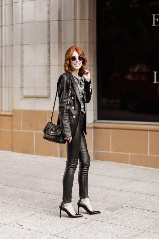 Cathy Williamson wearing leather pants with a blazer by Veronica beard and a Chanel Purse
