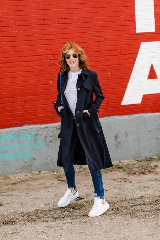 Dallas Blogger in White Tee, Navy Trench Coat, and white sneakers