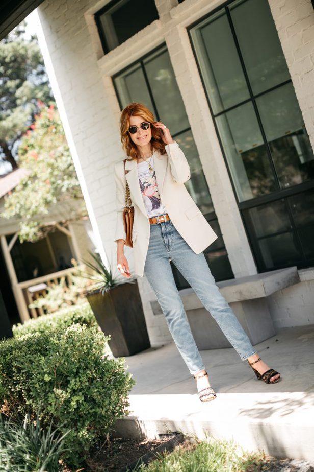 woman posing and wearing boyfriend blazer and jeans