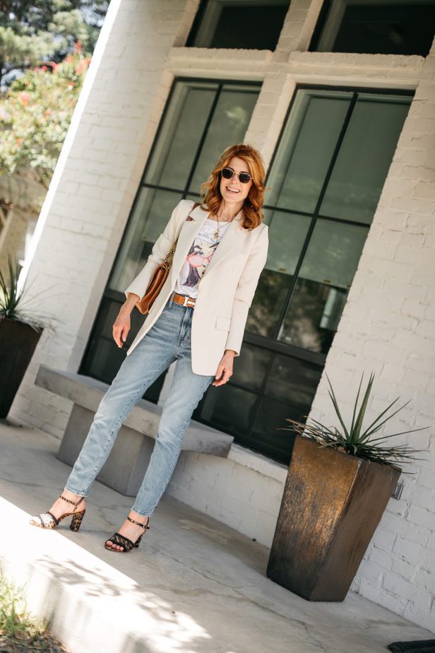 woman in white shire, blazer, and jeans 
