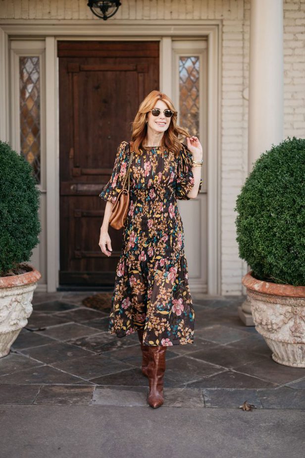 woman walking and wearing Winter To Spring Floral Dress and brown boots 
