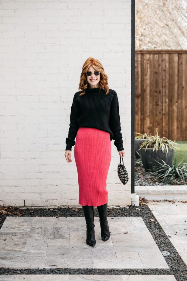 woman in black top and in BRIGHT PINK SKIRT