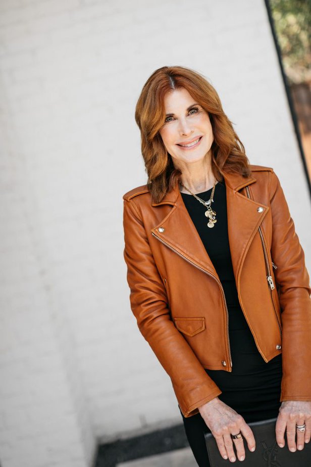 Dallas fashion blogger over 50 wearing the perfect little black dress with camel leather jacket and YSL bag